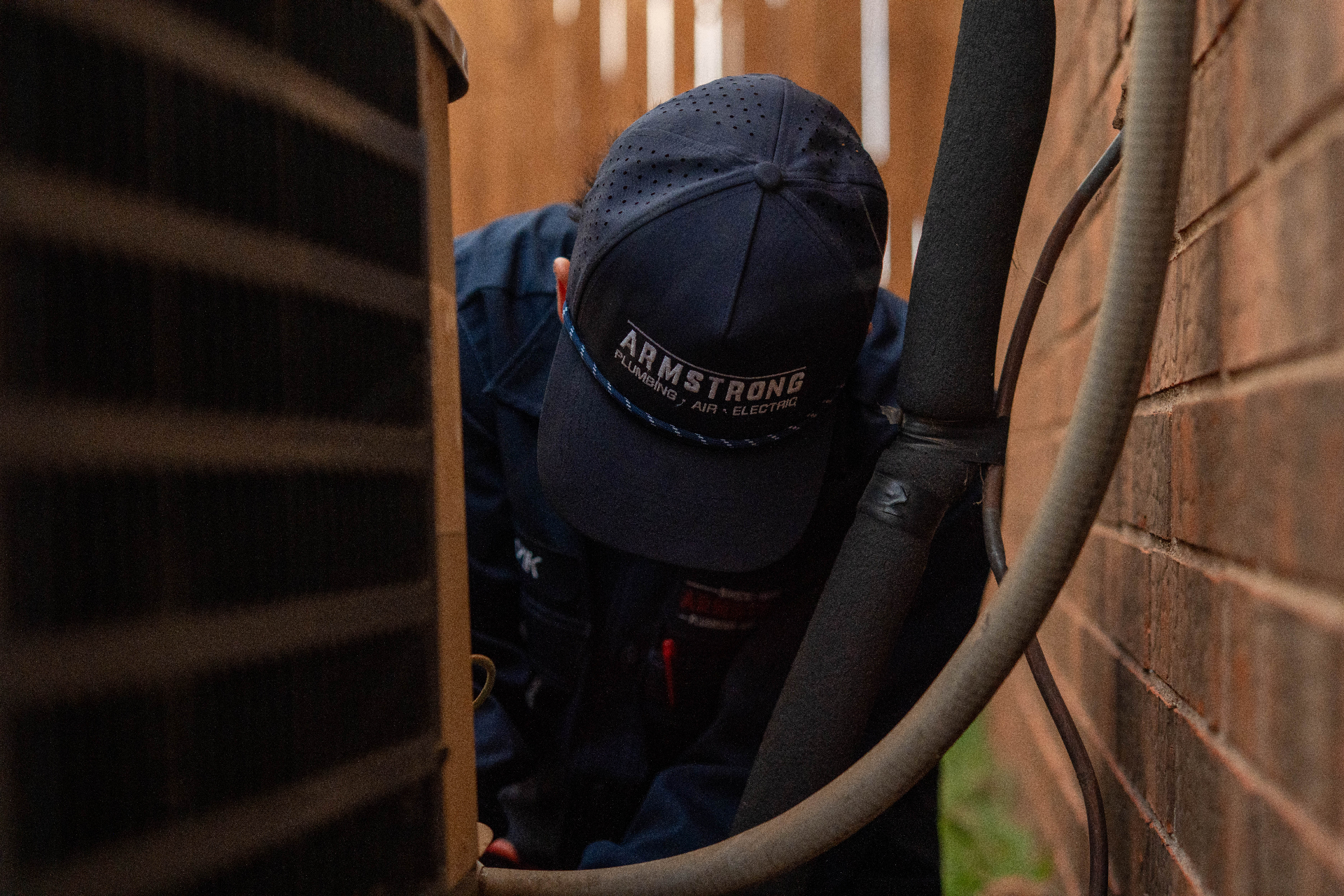 Armstrong technician working on AC unit