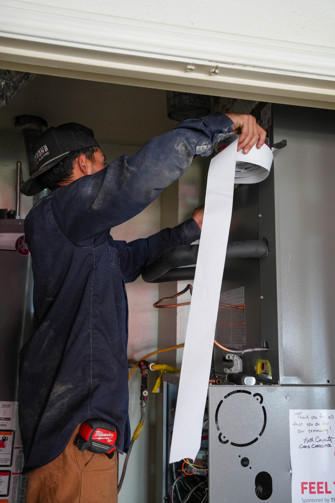 Armstrong HVAC technician servicing unit